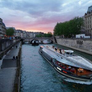 Evening cruise on the Seine River with a sunset backdrop