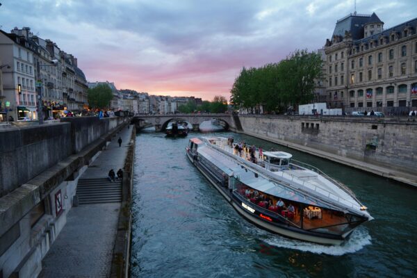 Evening cruise on the Seine River with a sunset backdrop