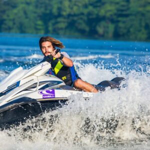 boy riding a jet ski