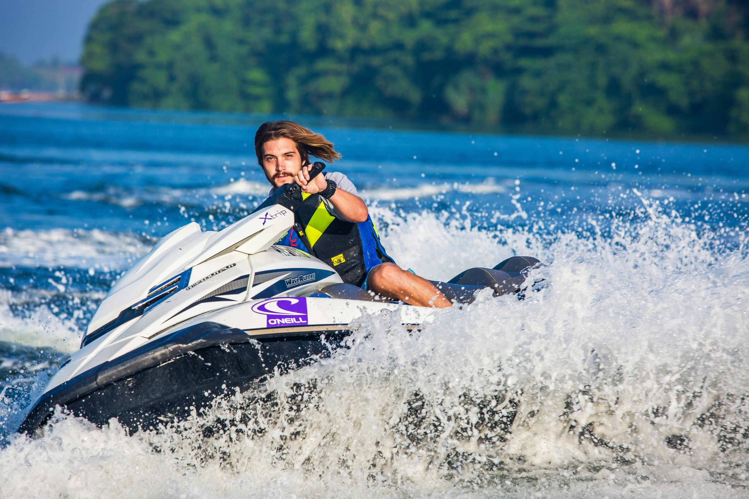 boy riding a jet ski