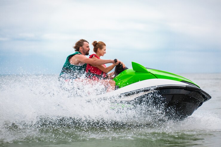 A couple enjoying a jet ski ride