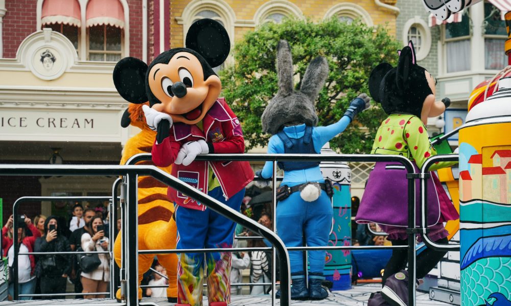 Disney Mouse Vibrant Disneyland Paris parade with iconic Disney mascot characters entertaining the crowd.